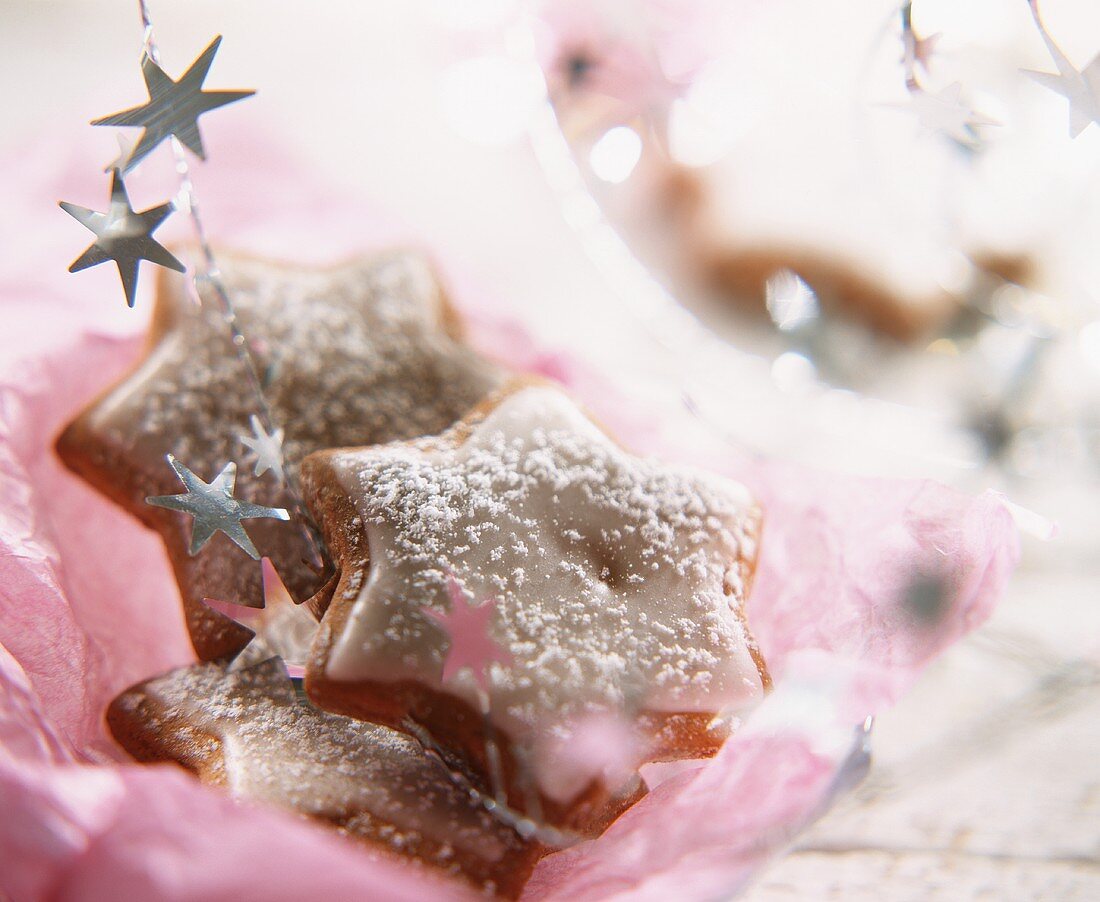 Cinnamon stars on pink wrapping paper