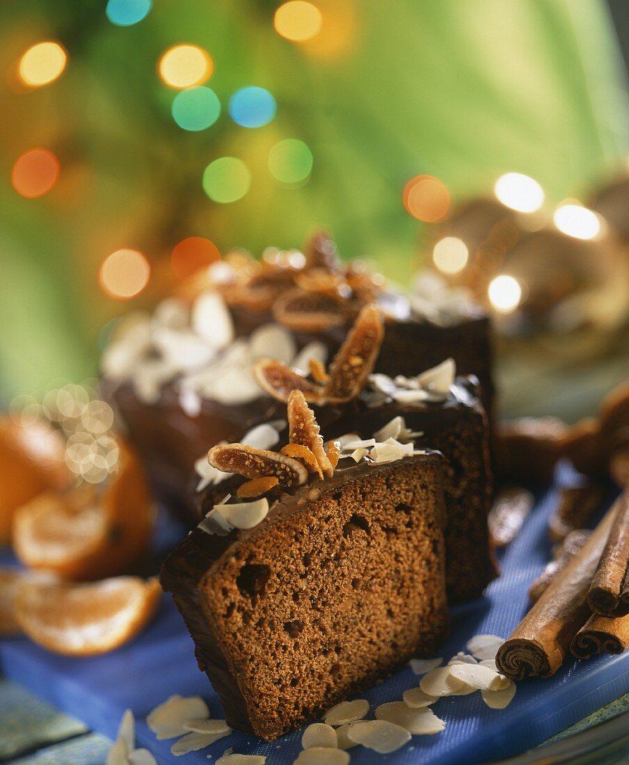 Spiced cake for Christmas with chocolate icing, pieces cut