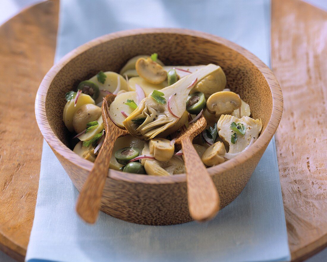 Potato salad with artichokes, mushrooms and olives