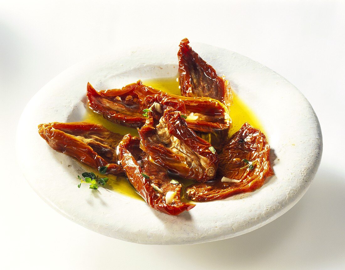 Dried tomatoes in oil on plate