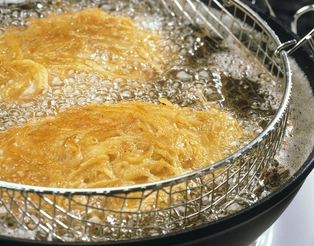 Frying turkey with potato coating in a deep fat fryer