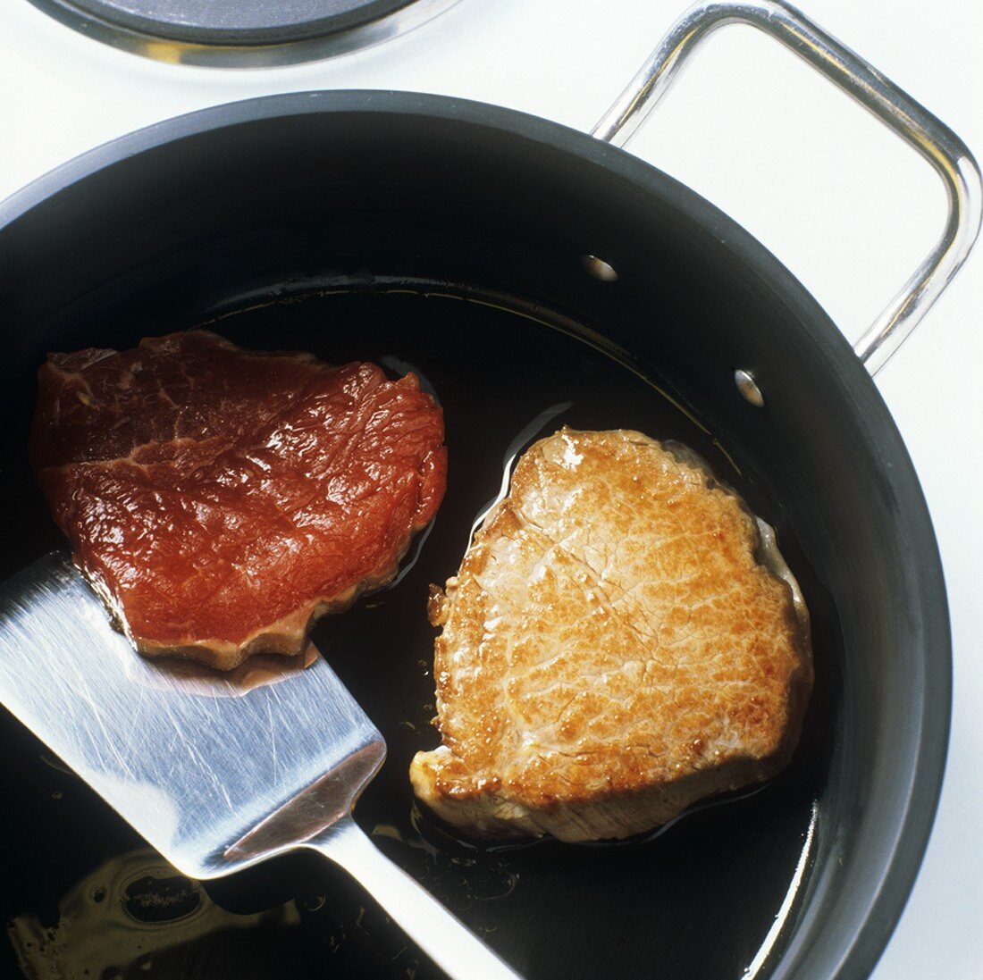 Frying beef sirloin in oil