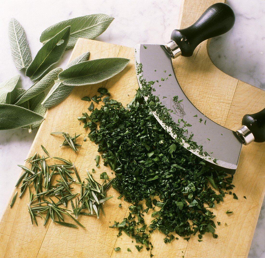 Chopping herbs with mezzaluna
