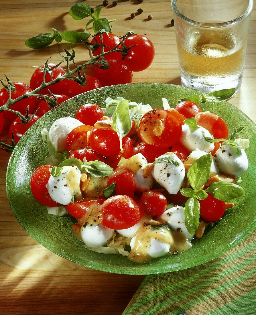 Mozzarella salad with cherry tomatoes and pine nuts