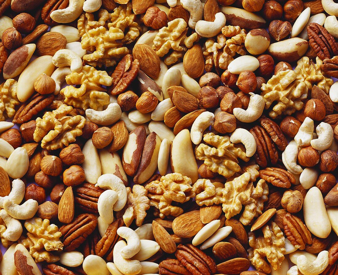 Various nuts without shells (filling the picture)