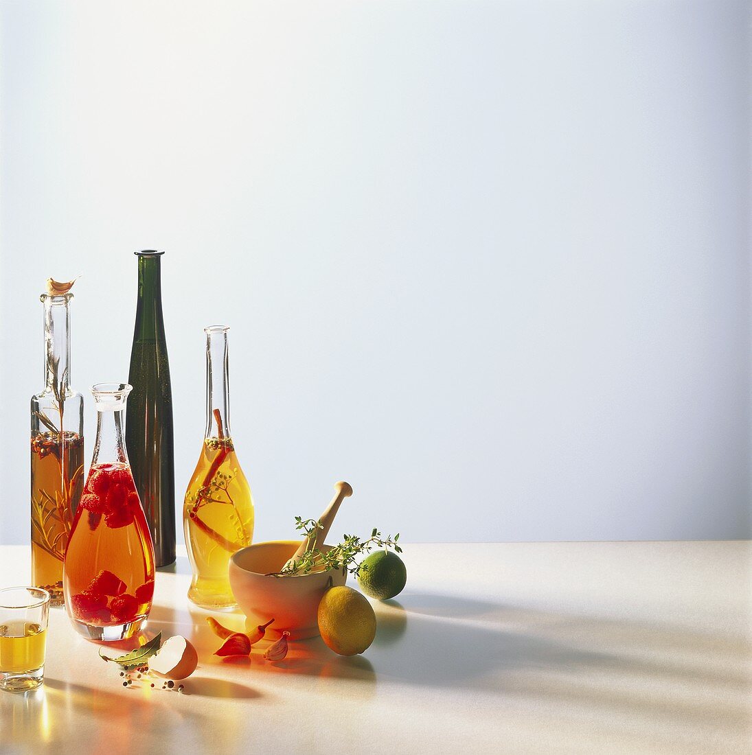 Still life with various types of vinegar & ingredients