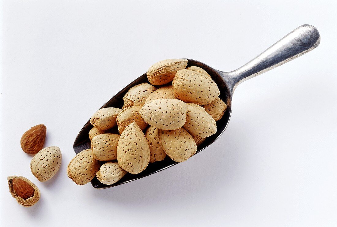 Almonds on and beside a scoop