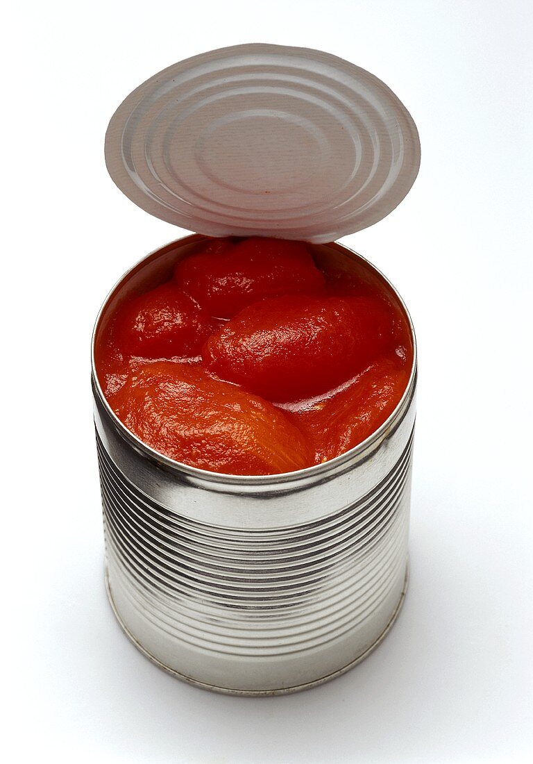 Peeled tomatoes in an opened tin