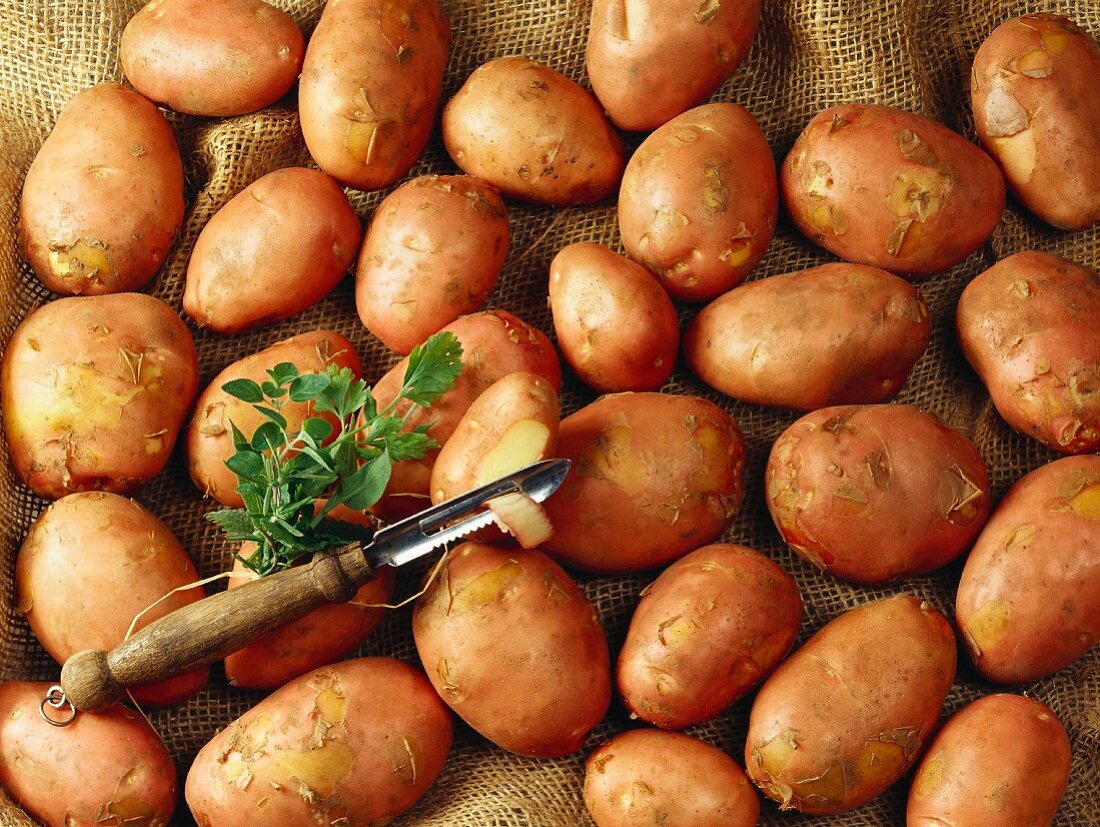 Potatoes and a potato peeler