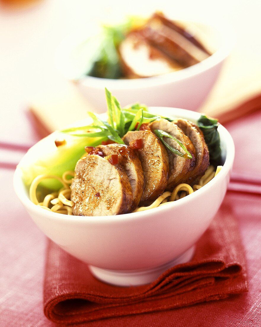 Sweet and sour pork on udon noodles