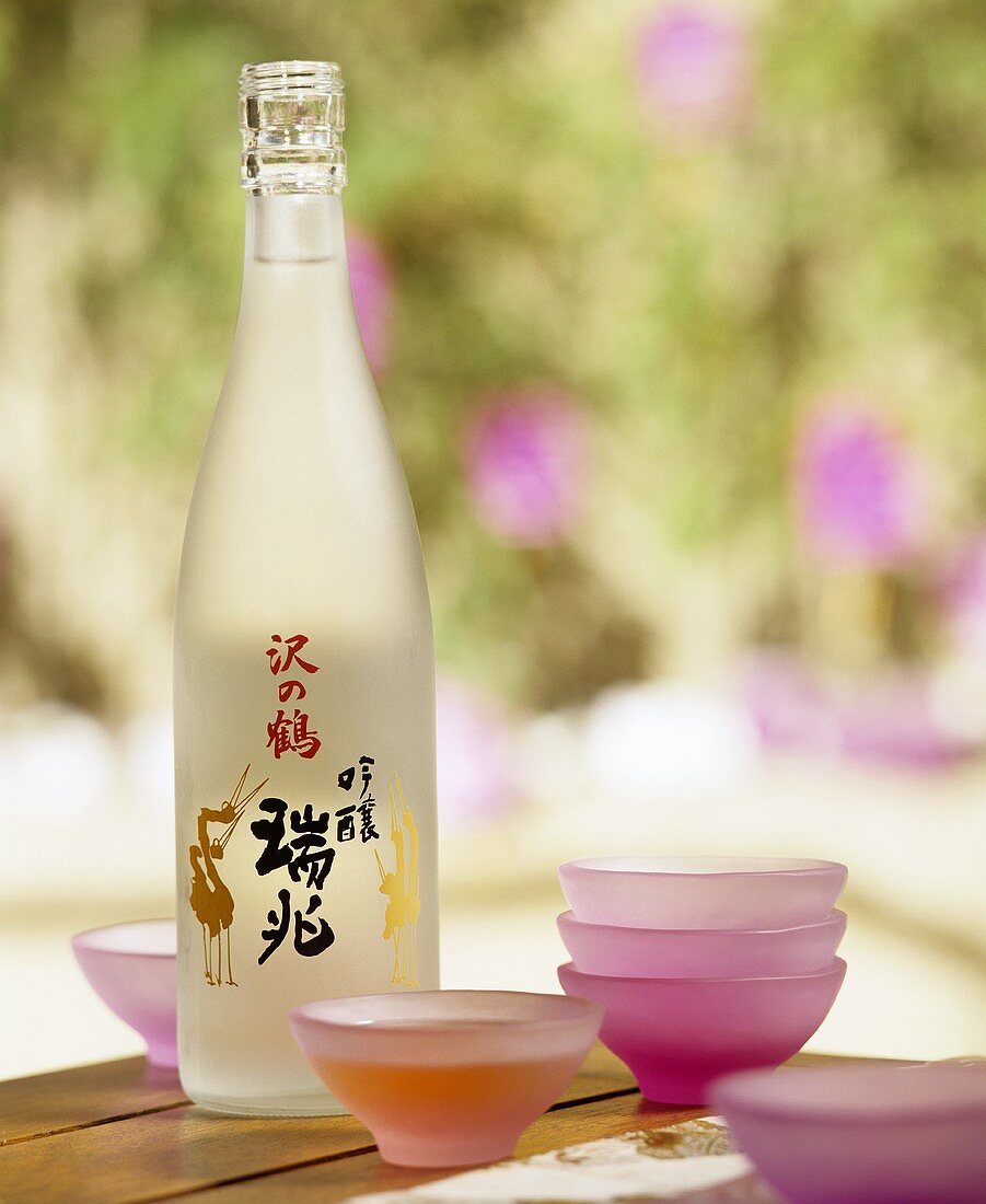 A bottle of sake and sake bowls