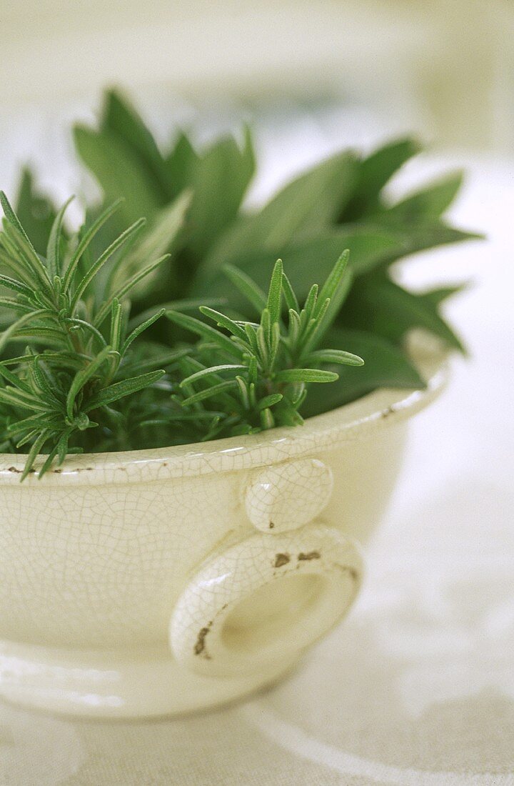 Rosemary and sage in a bowl