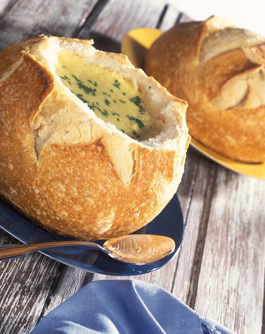 Brazilian maize soup in hollowed out bread