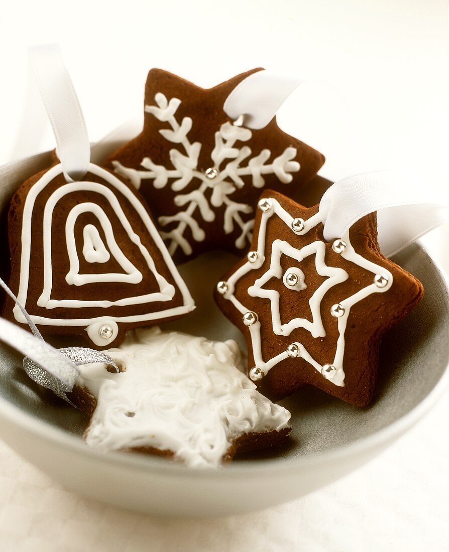 Decorated chocolate biscuits as tree ornaments