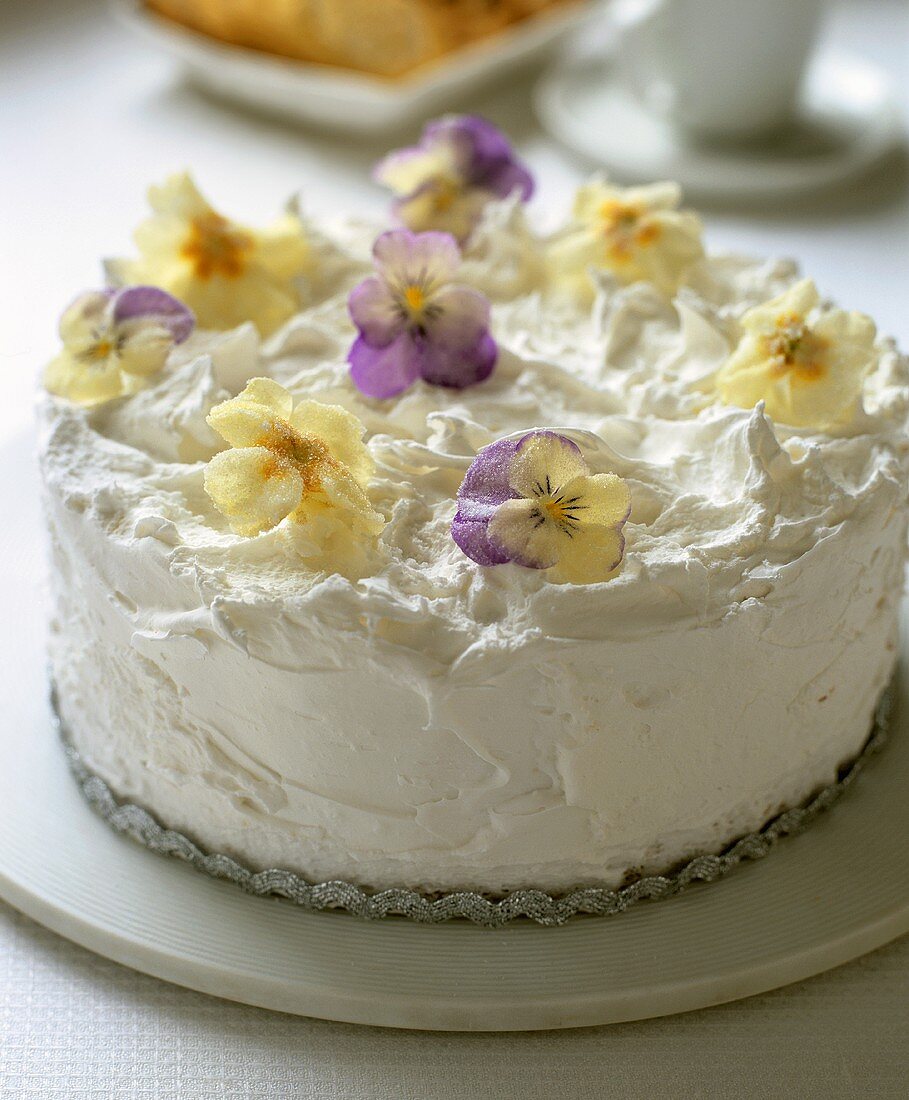 White cake with candied flowers