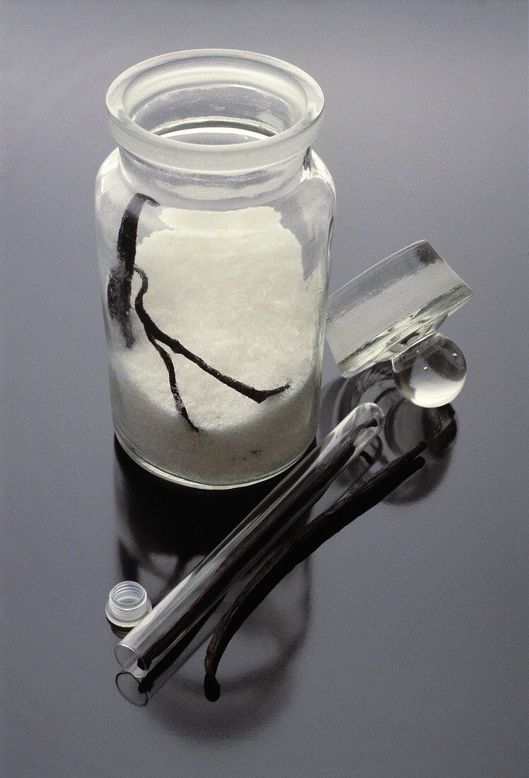 Making vanilla sugar: sugar with vanilla pod in jar