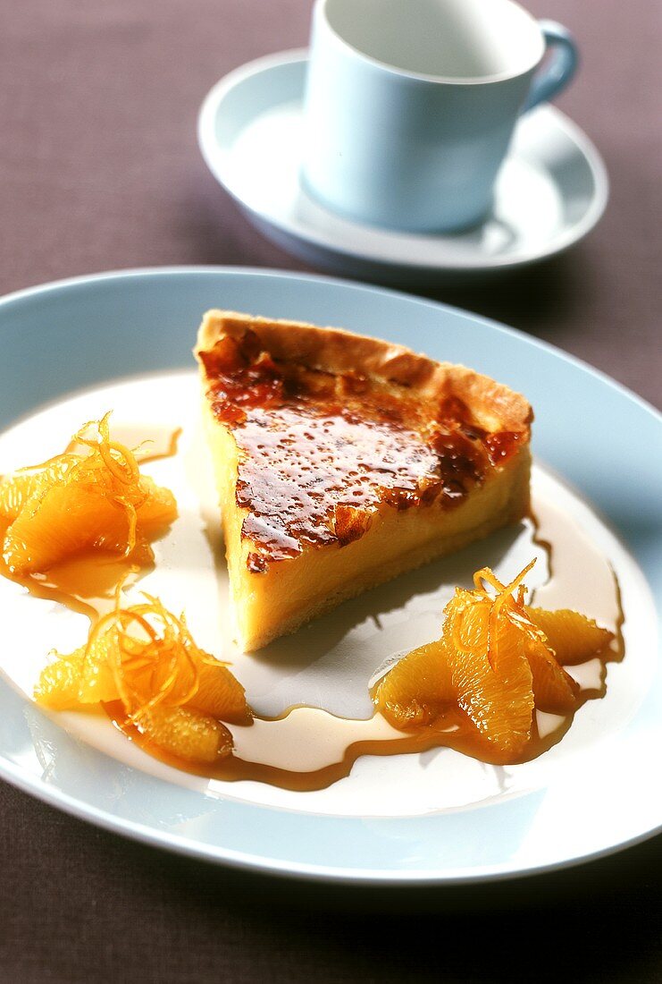 A piece of Crème Catalan tart with orange sauce