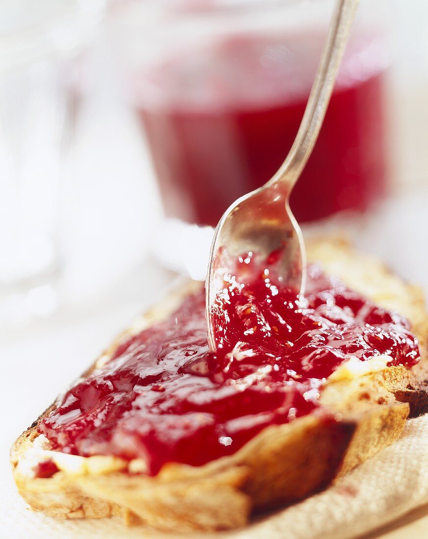 Slice of bread with strawberry jam