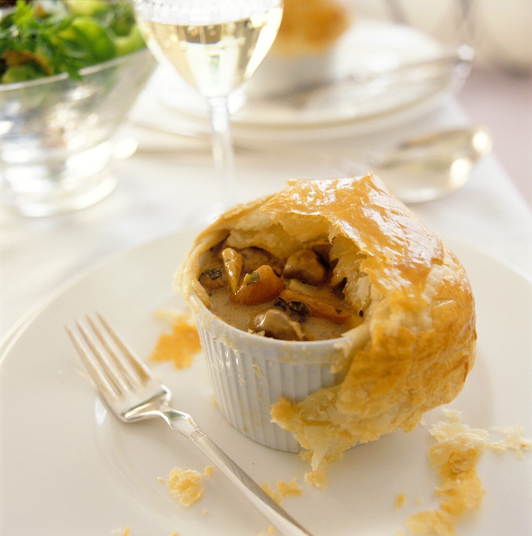 Mushroom soup with puff pastry topping