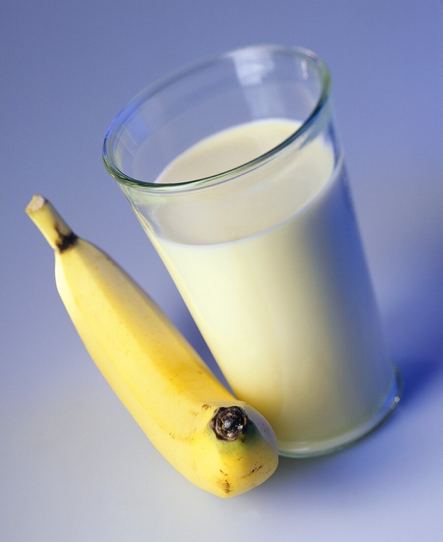 A glass of banana-flavoured milk and a banana
