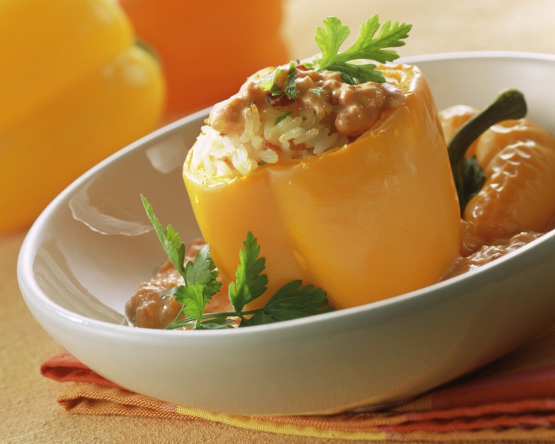 Stuffed pepper with rice and creamed tomato sauce