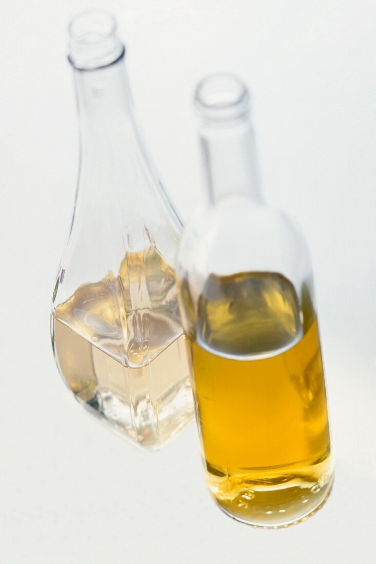 Vinegar and oil in two glass bottles