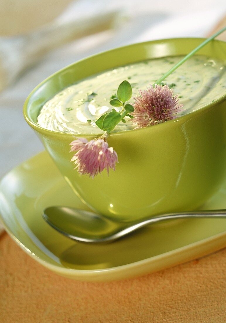 Béchamel sauce with herbs; chive flowers