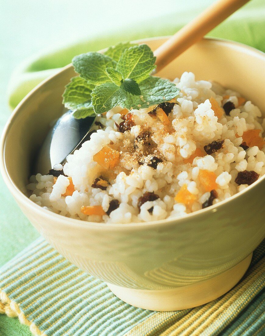 Rice pudding with dried fruit in bowl