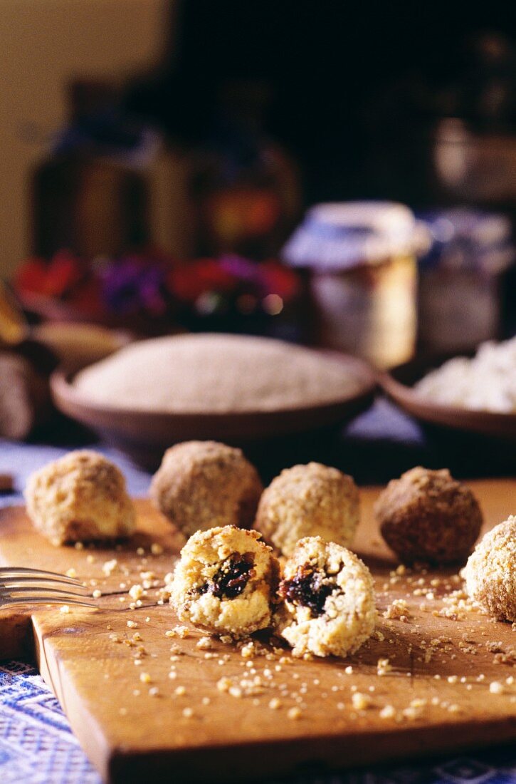 Curd cheese dumplings with plum filling on kitchen board