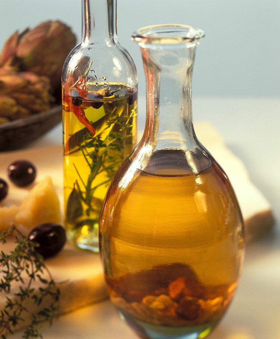 Bottle of aromatised vinegar & bottle of herb oil