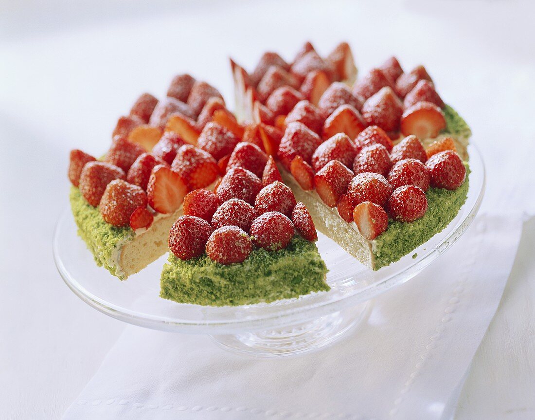 Strawberry gateau with lime cream, pieces cut