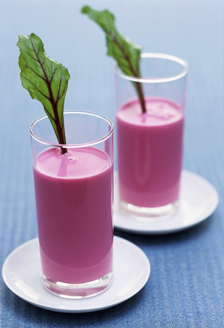 Beetroot yoghurt drink garnished with beetroot leaves