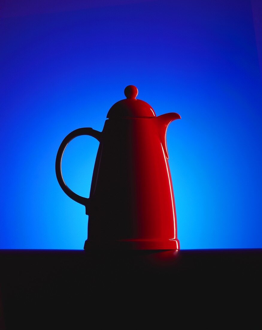 Red Thermos jug against blue background