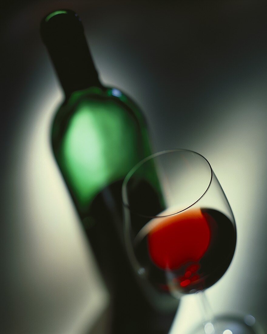 Red wine in glass and bottle