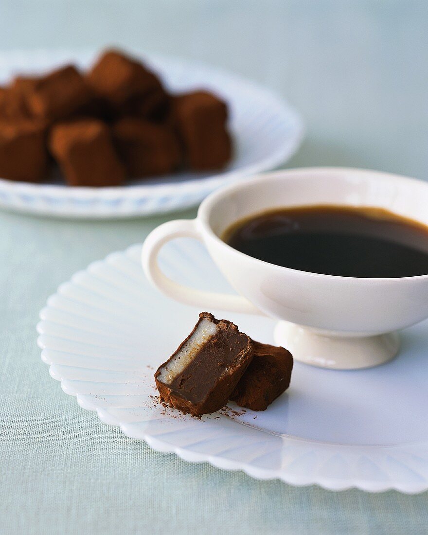 Cup of coffee and chocolate truffle