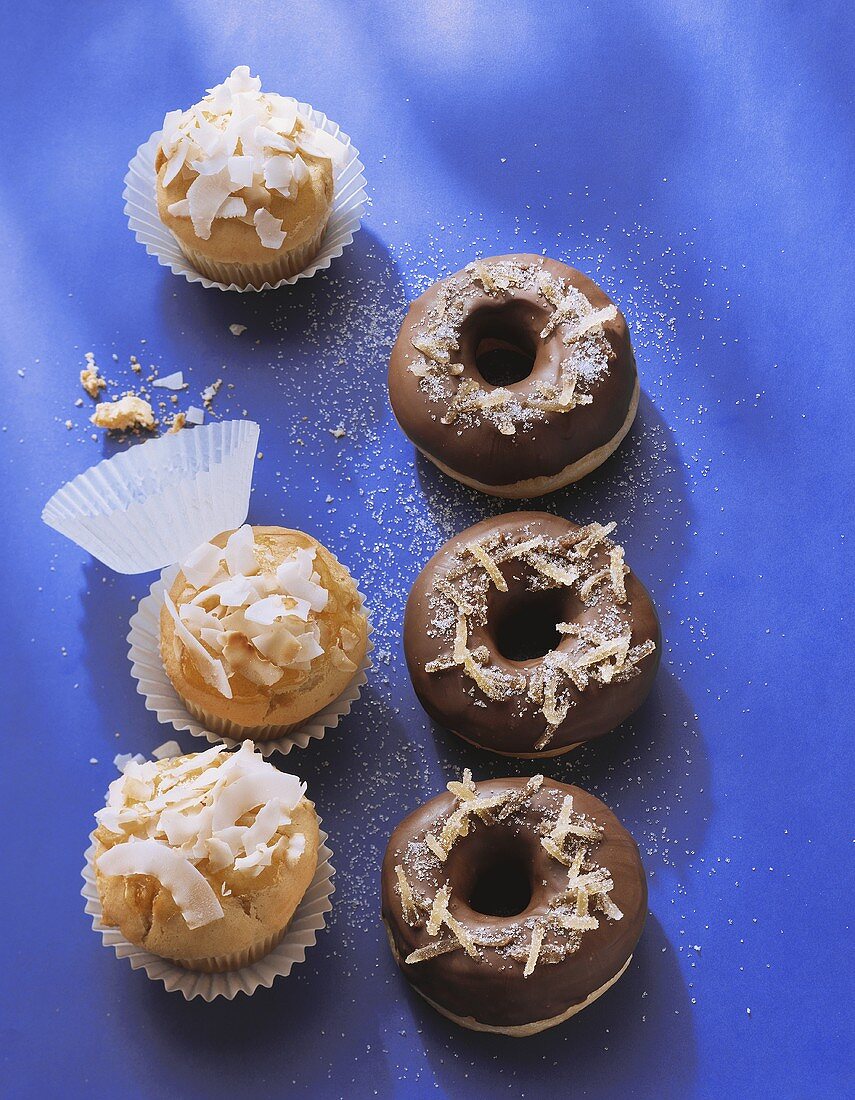Coconut muffins and chocolate donuts with candied ginger