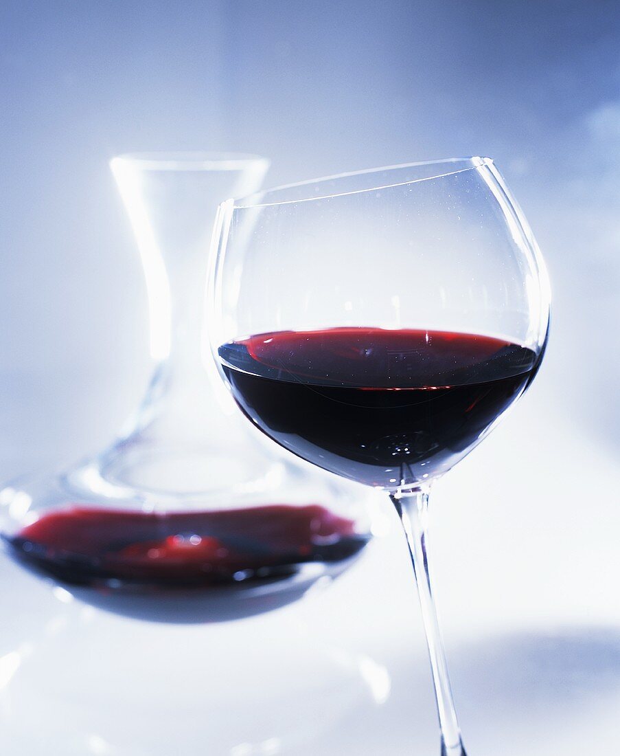 Red wine in glass and in carafe