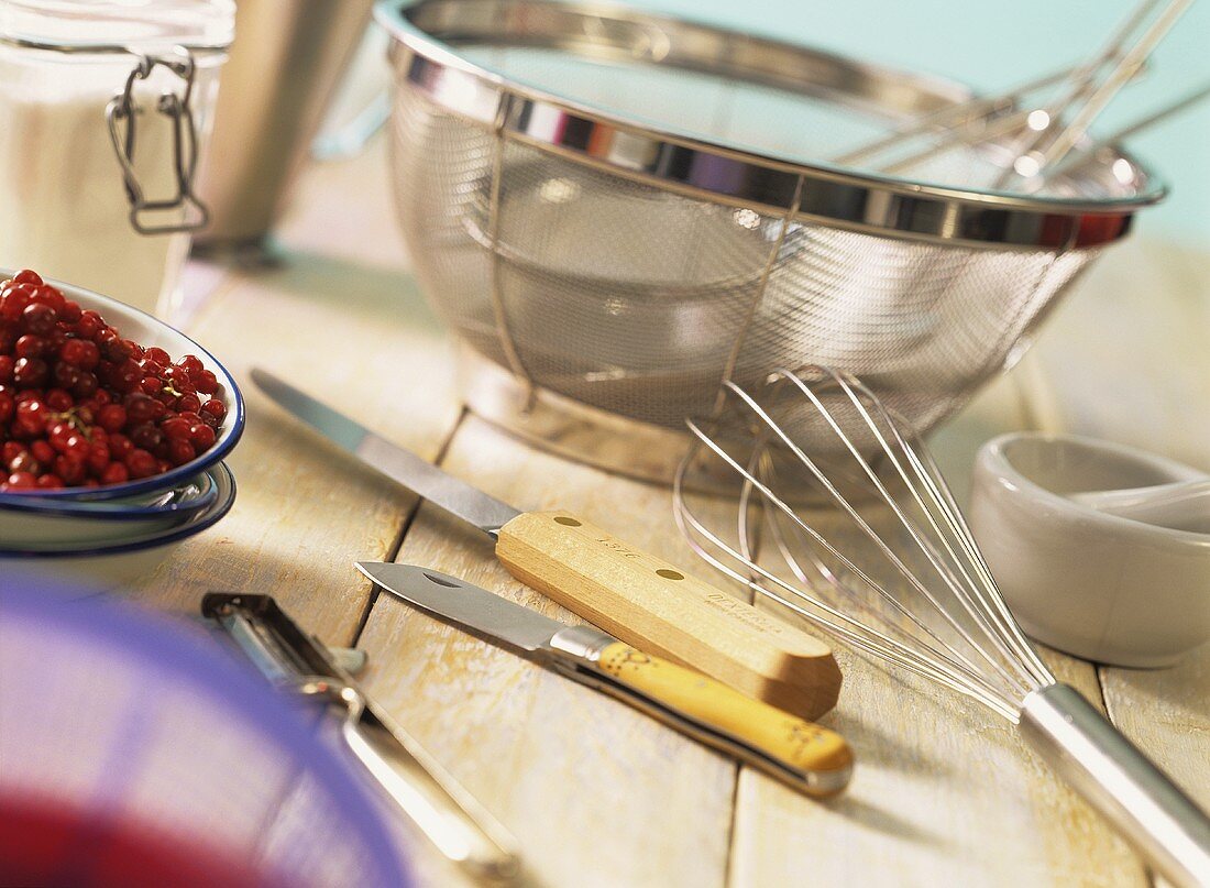 Various kitchen tools and cranberries