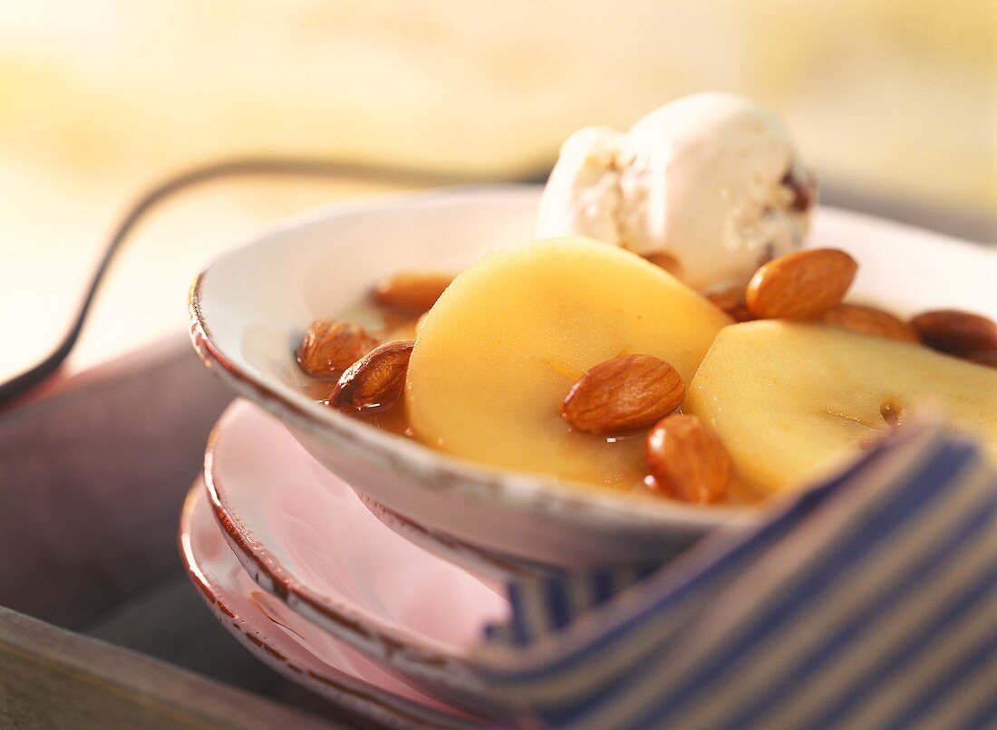 Apple rings in Calvados with almonds & scoop of ice cream
