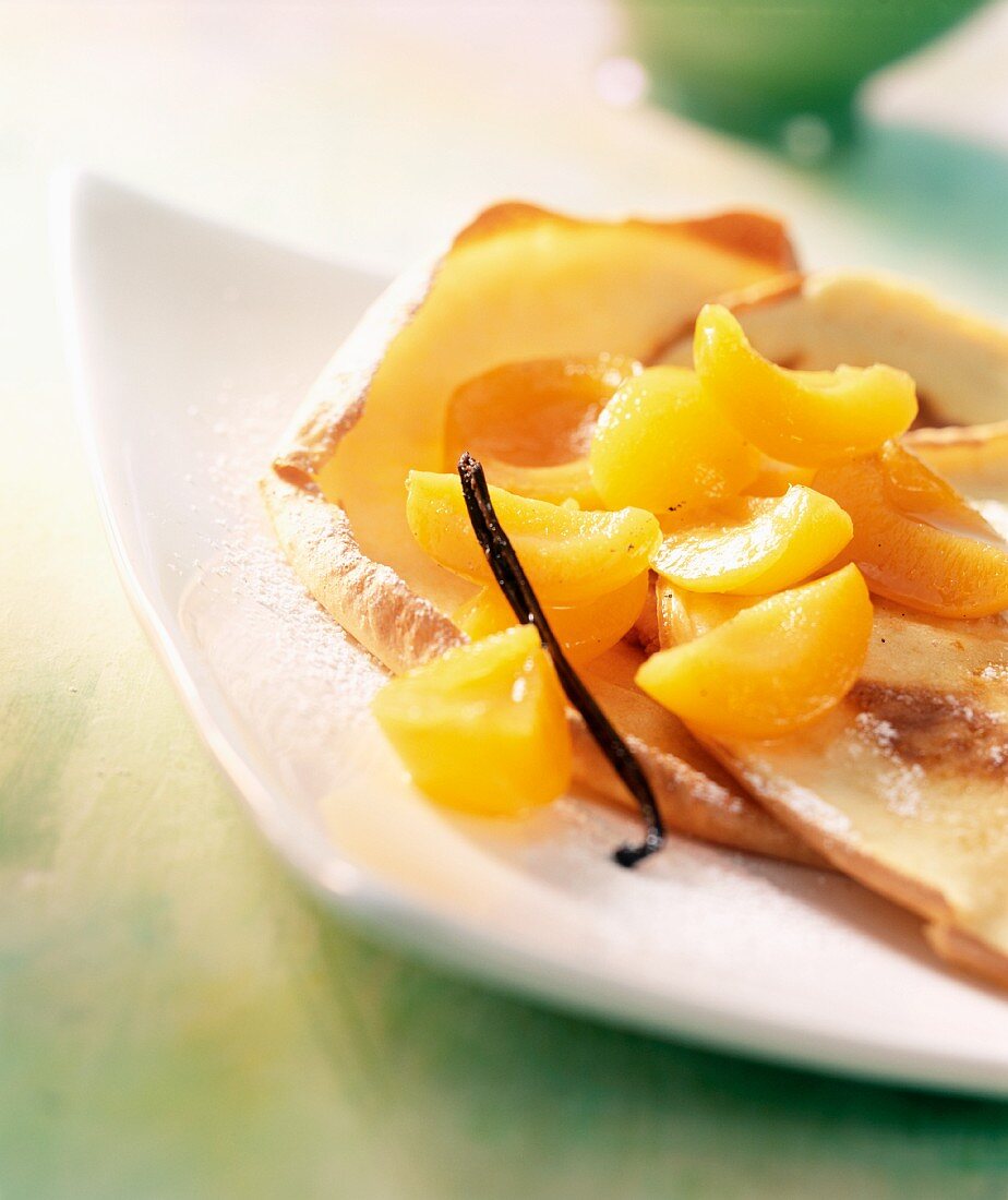 Apricot compote with thin crepes