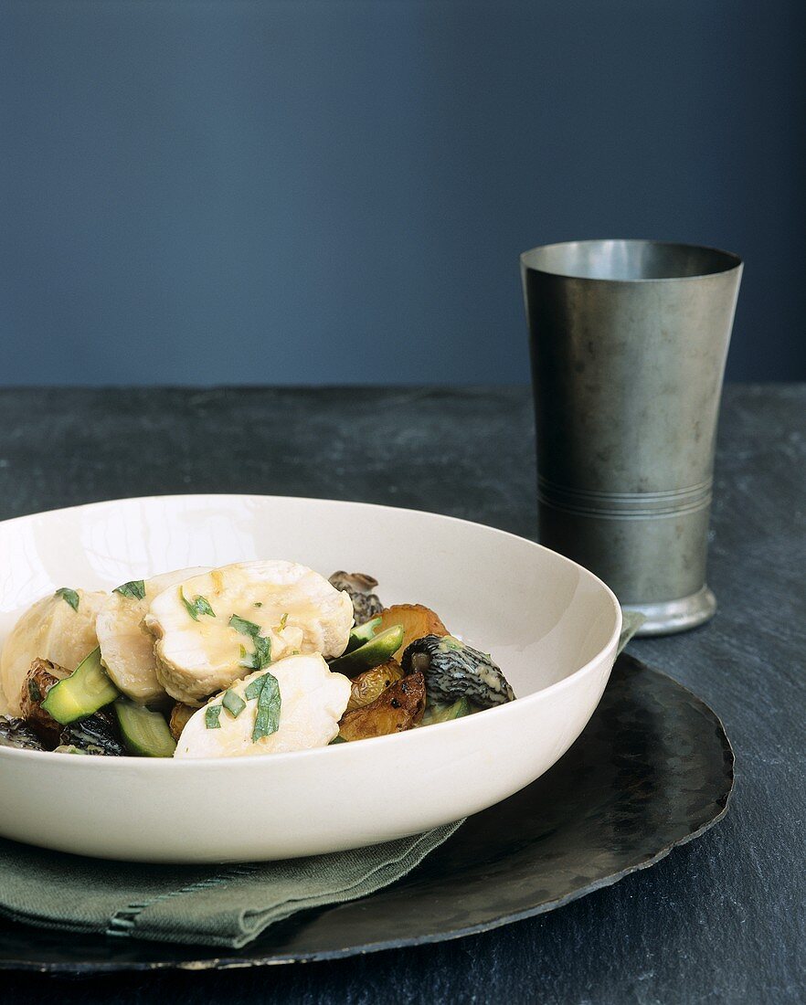 Poached chicken breast with tarragon sauce, morels & vegetables