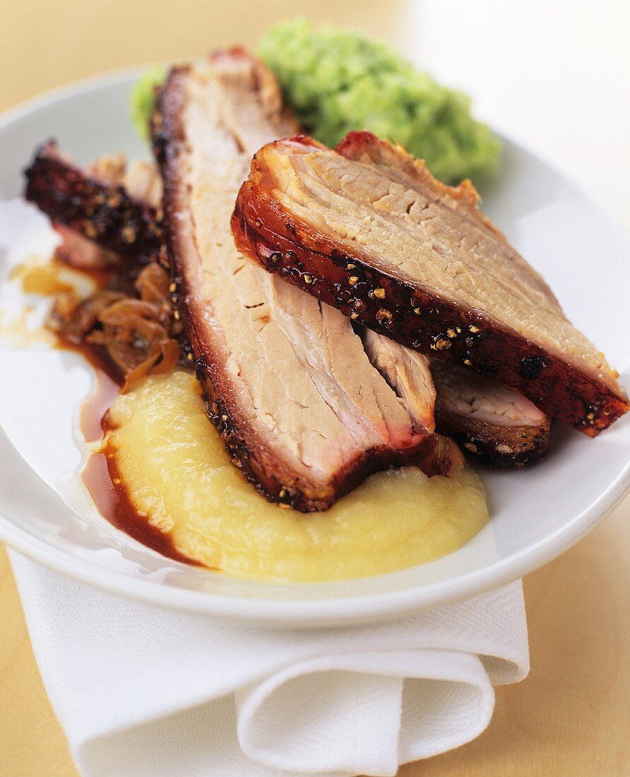 Roast pork with apple sauce and pea puree