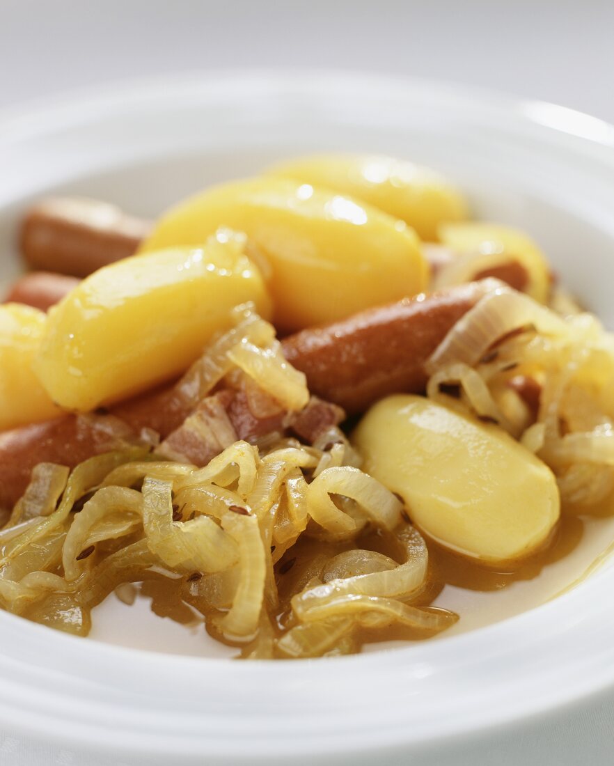 White cabbage stew with potatoes and sausages