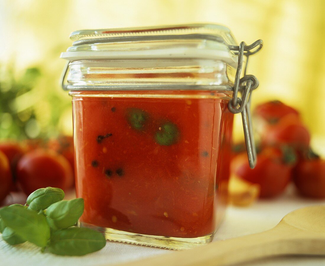 Spicy tomato and pepper sauce in preserving jar