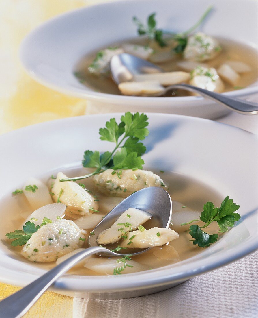 Clear asparagus soup with semolina dumplings