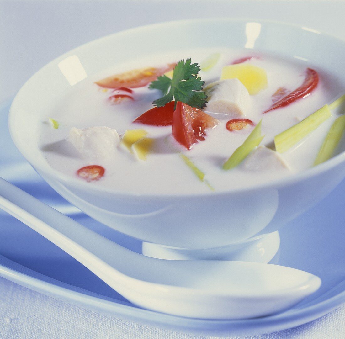 Thai coconut milk soup with chicken, tomatoes, lemon grass