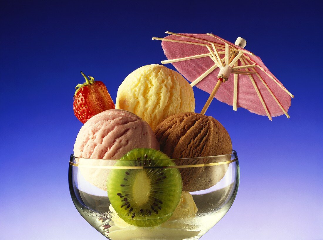 Mixed ice cream sundae decorated with a parasol