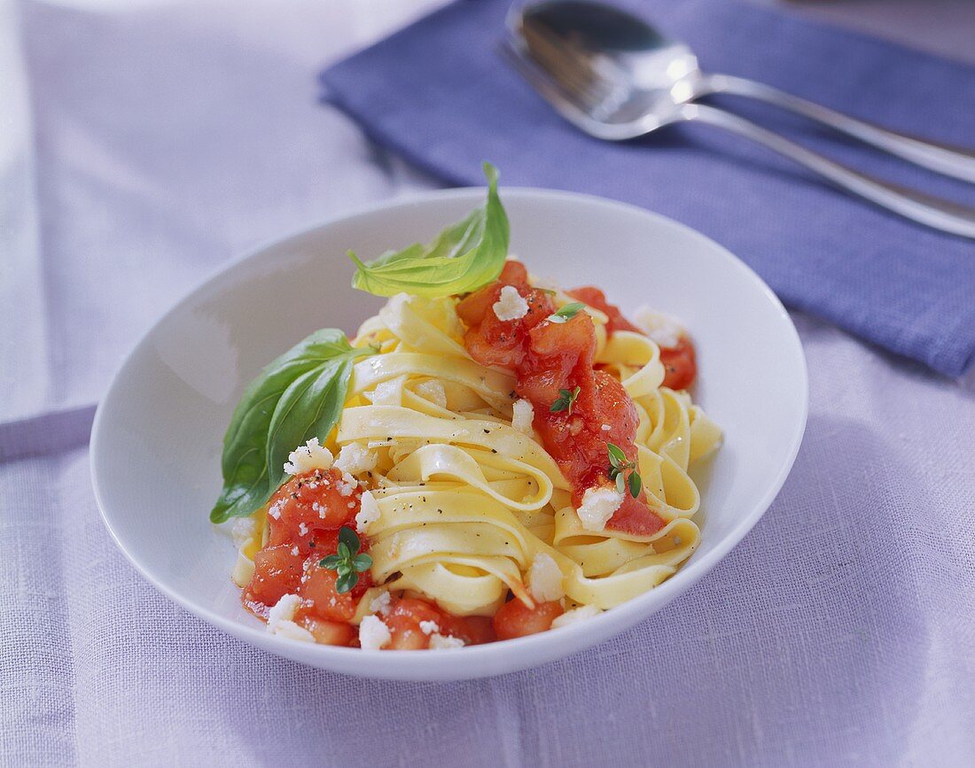 Ribbon pasta with tomato and sheep's cheese sauce