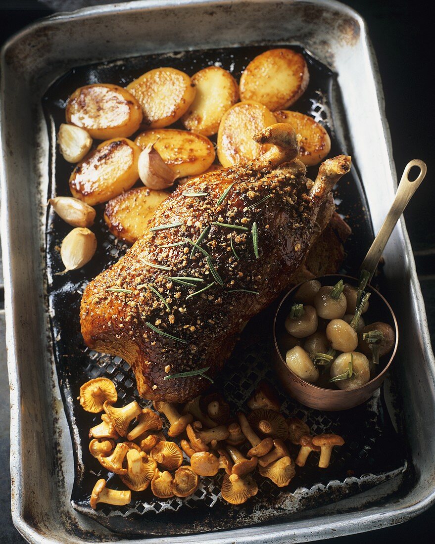 Glazed duck with roast potatoes, garlic and turnip