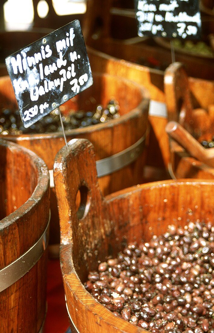 Olives in wooden tubs at the market